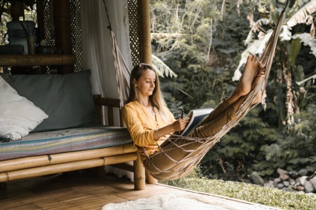 lento - Serene scene of a woman sketching in a hammock surrounded by lush greenery.